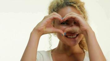 Beautiful woman showing heart shape gesture video