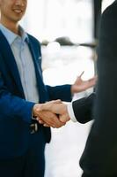Business people shaking hands during a meeting. Two happy mature business men photo