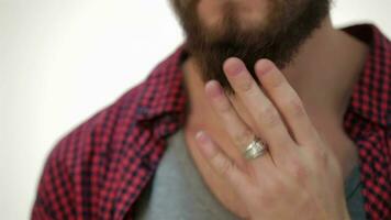 Closer portrait of man touching his perfect beard video