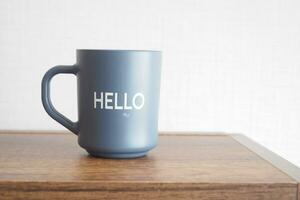 blue coffee cup with hello word photo