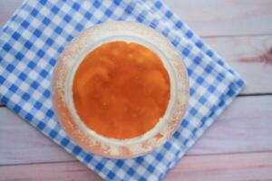 homemade ghee in container on a table , photo