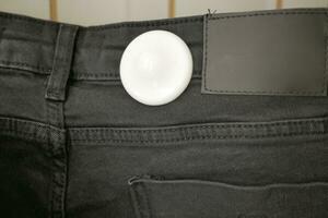 Clothing security tag on a jeans , photo
