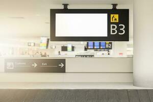 Blank billboard at baggage claim in the airport photo