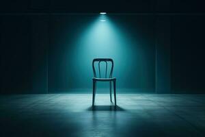 Empty chair in the rays of a spotlight against the background of concrete walls photo