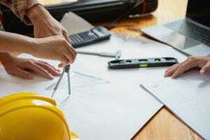 Concept meeting engineers or architects for projects working with partners and engineering tools to create models and blueprints at the job site. construction concept. Engineer concept. photo