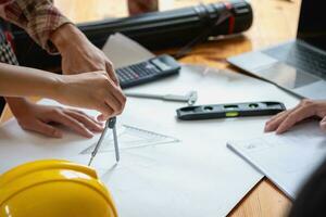 Concept meeting engineers or architects for projects working with partners and engineering tools to create models and blueprints at the job site. construction concept. Engineer concept. photo