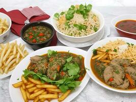 Free photo dinner set with dolma soups, salads and chicken with rice and french fries Generative Ai