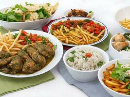 Free photo dinner set with dolma soups, salads and chicken with rice and french fries Generative Ai
