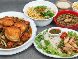 Free photo dinner set with dolma soups, salads and chicken with rice and french fries Generative Ai