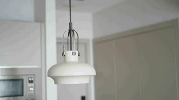 gray ceiling lamp hanging in a room video