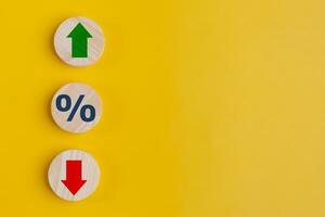 Cube block with percentage symbol icon. Interest rate financial and mortgage rates concept. Wood cube change arrow down to up. Interest rate, stocks, ranking. Business and finance concept. photo