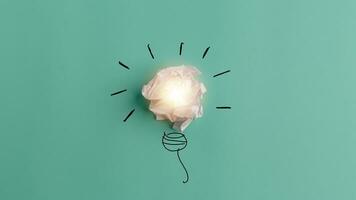 Inspiration concept crumpled paper light bulb metaphor for good idea photo