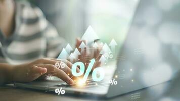 Interest rate and dividend concept. Women and percentage symbols and an up arrow, interest rates continue to increase, and return on stocks and mutual funds. photo