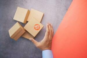 top view of 50 percent discount sign on a box on table photo