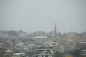 top view of Snowfall on buildings in istanbul city photo