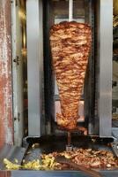 rotating traditional gyros meat close up photo