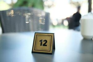 14 number sign number on cafe table . photo