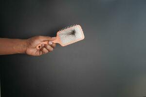 man hold his list hair close up photo