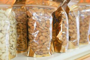 almond nuts in a packet in a shelf photo
