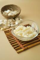 close up of minced garlic on a wooden spoon photo