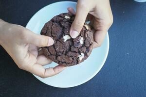 overhead view of breaking sweet cookies on photo