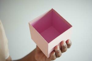 top view of person open a empty small gift box photo