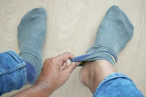 men put on gray color light socks photo