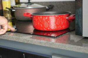 cooking pan on electric stove, electric stove is heated to red. photo