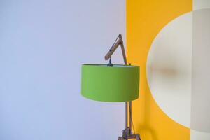 a lamp in home against white wall photo