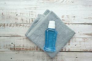 mouthwash liquid in a container on table photo