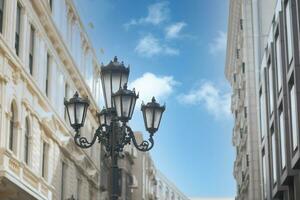 Elegant street lamp surrounded bu buildings photo