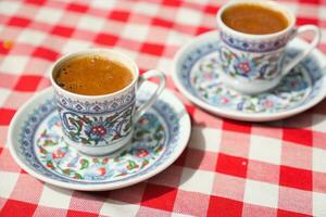 a cup of turkish coffee on table photo