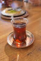 Traditional turkish tea on white table . photo