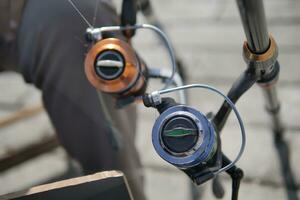 Fisherman with rod, spinning reel , photo