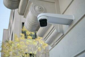 CCTV security camera operating outdoor photo