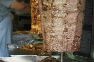 rotating traditional gyros meat close up photo