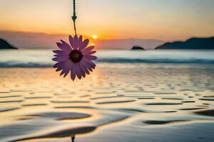 a flower hanging from a rope on the beach. AI-Generated photo