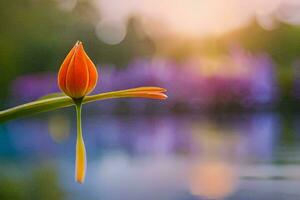 a single orange flower is standing on a stem in front of a lake. AI-Generated photo