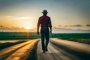 un hombre en un sombrero camina abajo un suciedad la carretera a puesta de sol. generado por ai foto