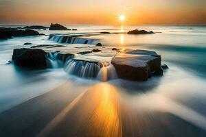 a beautiful sunset over the ocean with rocks and water. AI-Generated photo