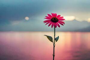 a single pink flower stands in front of a lake. AI-Generated photo