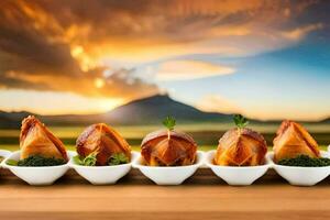 a line of food on a table with a sunset in the background. AI-Generated photo