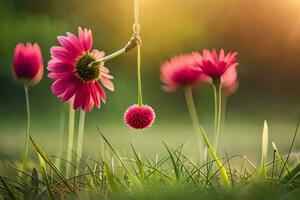 pink flowers hanging from a string in the grass. AI-Generated photo