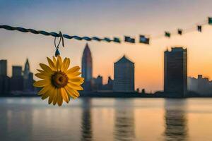 sunflower hanging from a rope in front of a city skyline. AI-Generated photo