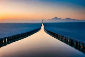 a long pier with a lighthouse at sunset. AI-Generated photo