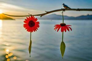 two red flowers hanging from a branch over the water. AI-Generated photo