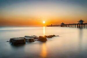 the sun sets over the ocean and pier. AI-Generated photo