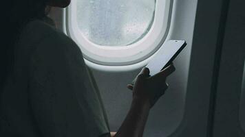 Plane cabin and a beautiful woman gazing out of the window video