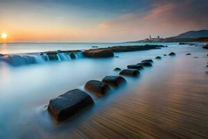 a long exposure photograph of rocks on the beach at sunset. AI-Generated photo