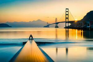 un hombre soportes en un muelle mirando a el dorado portón puente. generado por ai foto